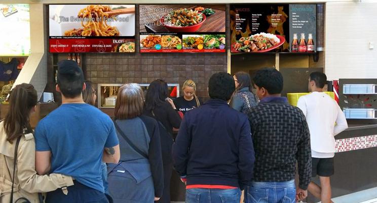 Line up for a food court stall that has digital menu boards