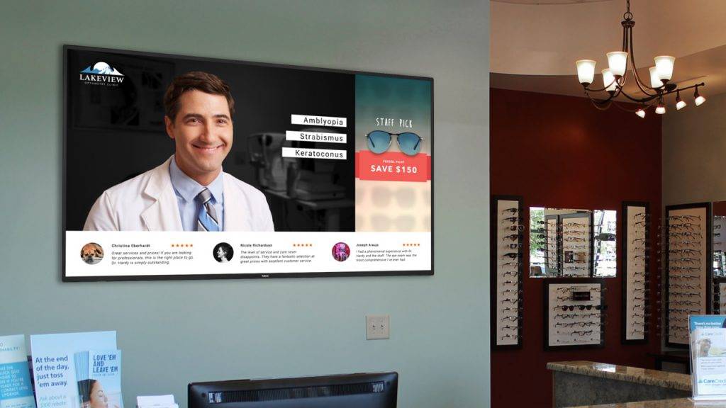 Digital signage TV display in an optometrist's reception with content on the doctor promotions and social media reviews