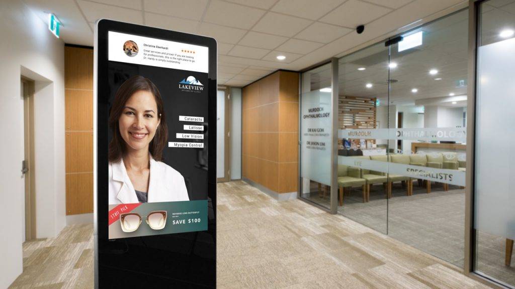 Digital signage kiosk display showing info about the Optometrist social media reviews and promotions
