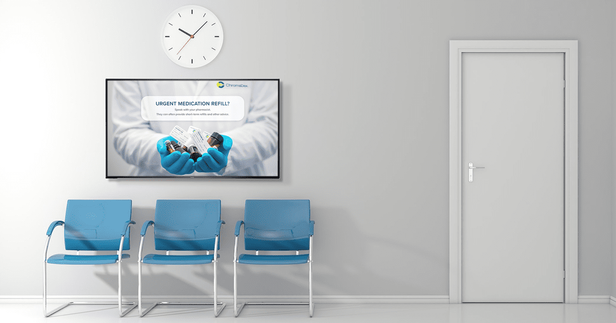 visitor and patient waiting room in the clinic with blue chairs and digital signage